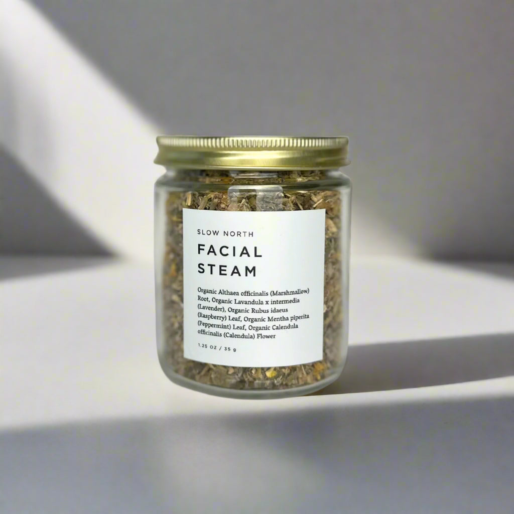 Jar of facial steam with a label on a light background