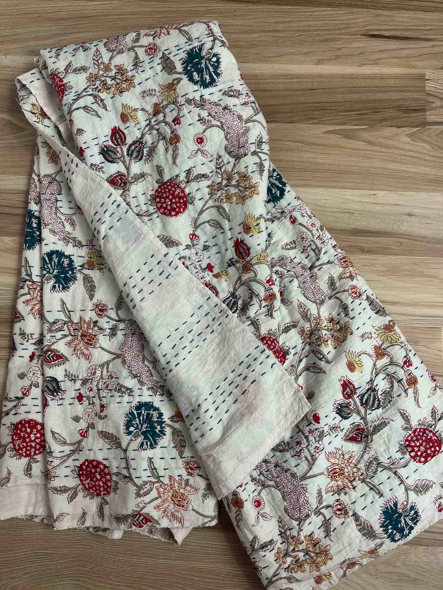 Floral patterned fabric on a wooden surface