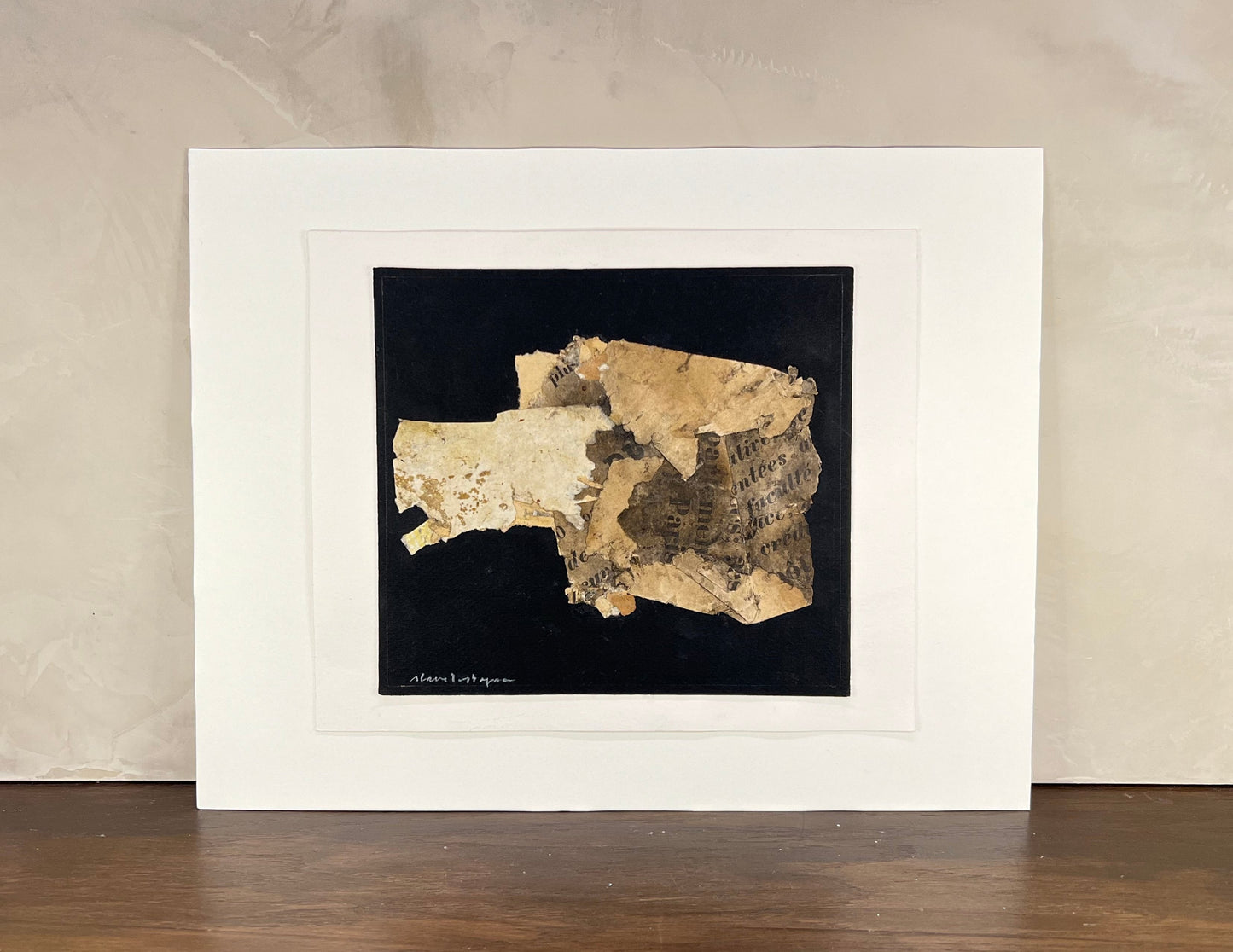 Framed artwork of a textured map on a black background