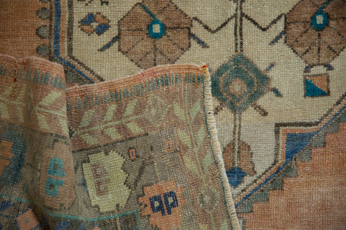 Close-up of a patterned rug with intricate designs.