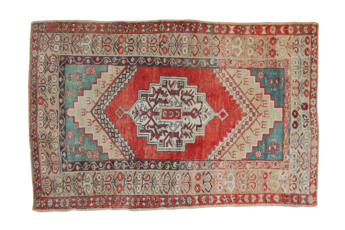 Decorative rug with intricate patterns on a white background