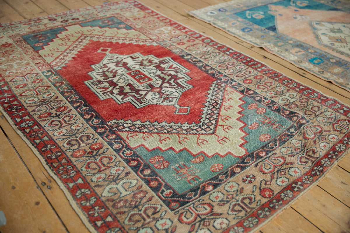 Decorative rug with intricate patterns on a wooden floor