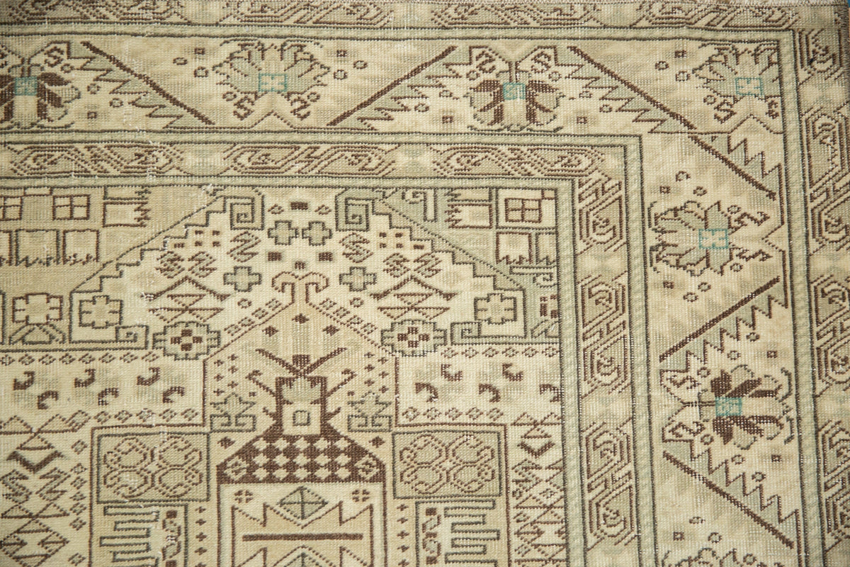 Close-up of a patterned rug with geometric designs.