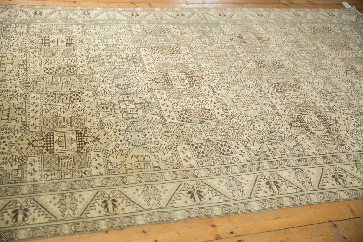 Patterned rug on a wooden floor