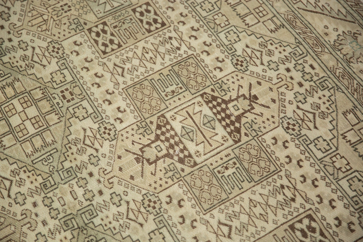 Close-up of a patterned rug with geometric designs.