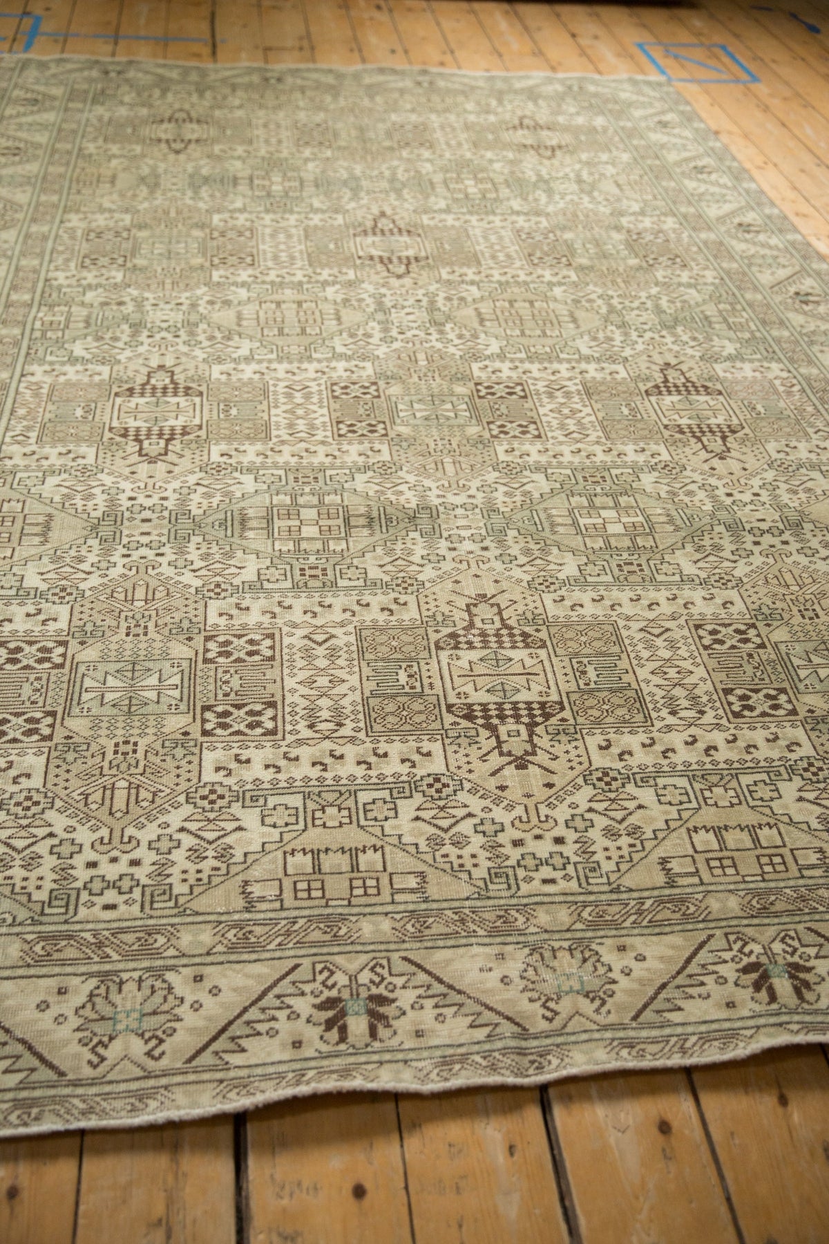 Patterned rug on a wooden floor
