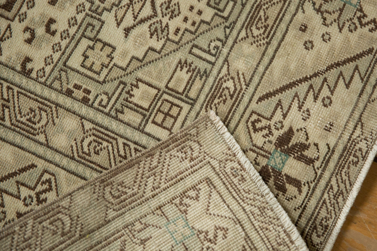 Close-up of a patterned rug with geometric designs.