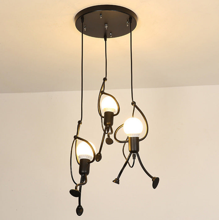 Modern pendant light fixture with three hanging bulbs on a plain background