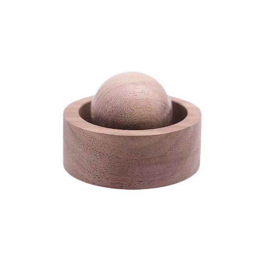 Wooden ball inside a wooden bowl on a white background