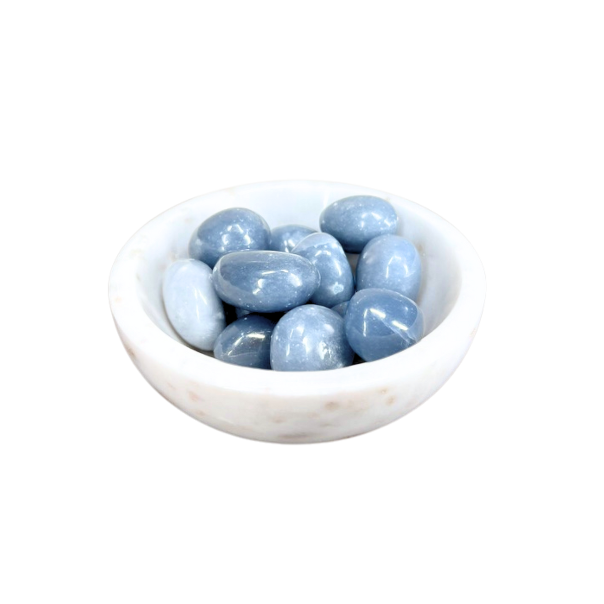 White bowl filled with light blue stones on a white background