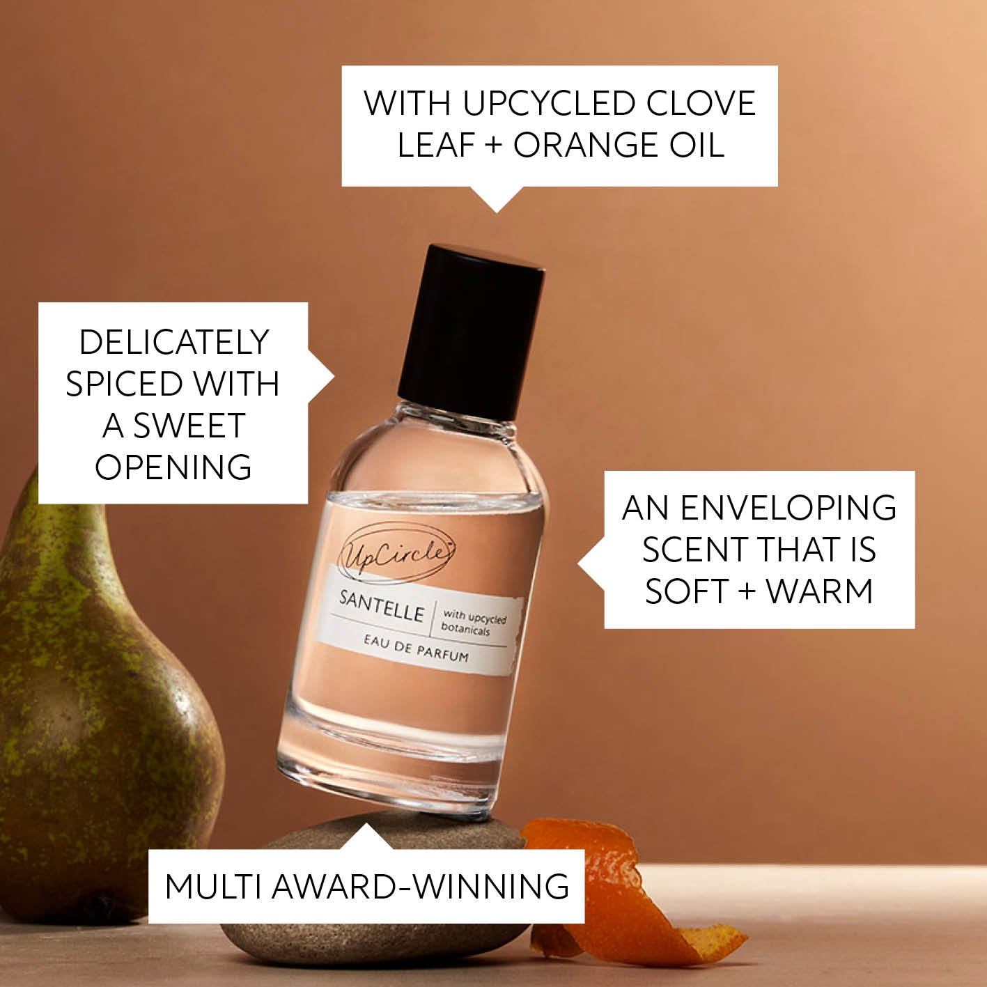 Bottle of Santele eau de parfum with text describing its ingredients and qualities on a brown background.