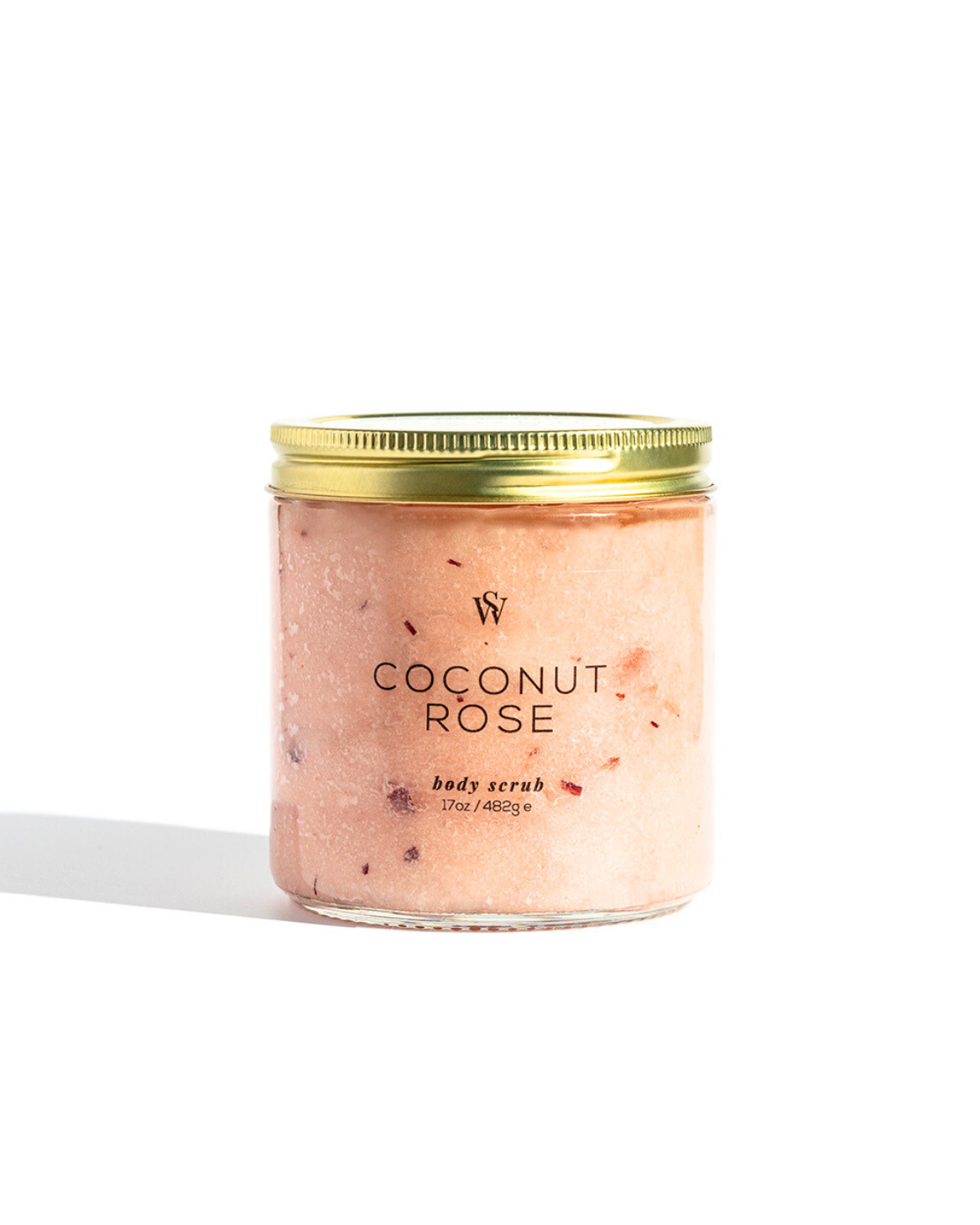 Jar of coconut rose body scrub with a gold lid on a white background
