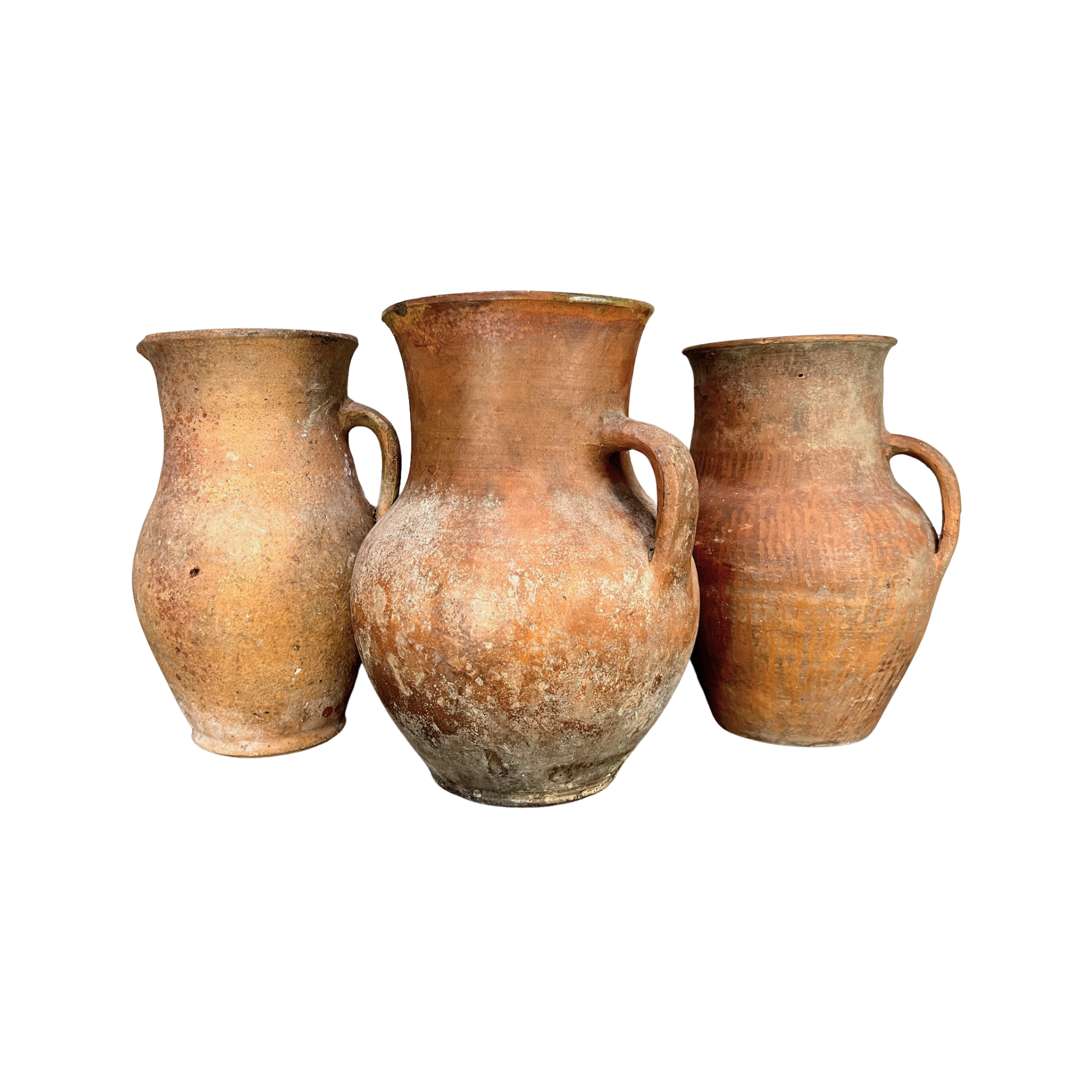 Three terracotta pots of varying sizes on a white background