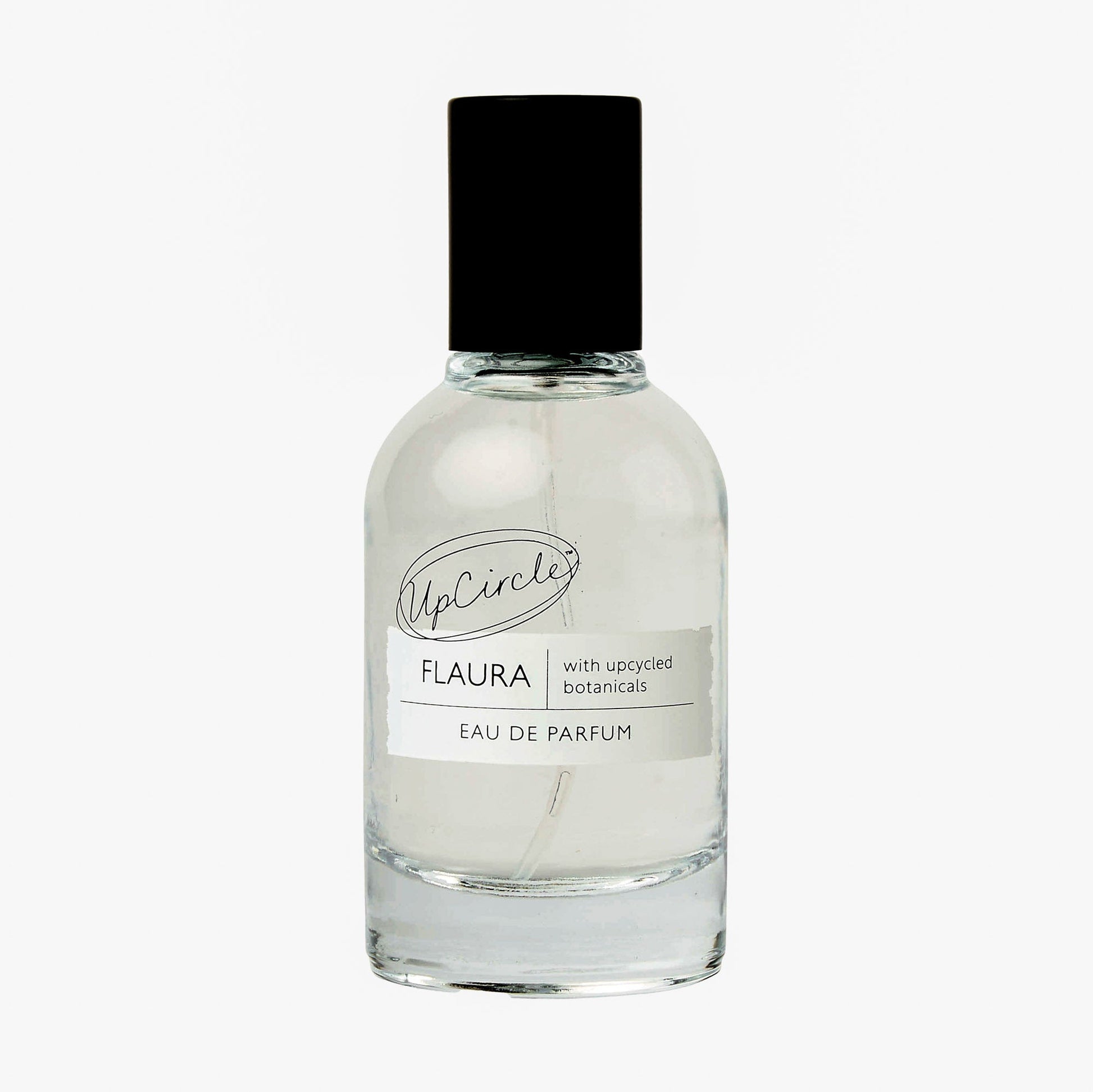 Clear glass perfume bottle with black cap on a white background