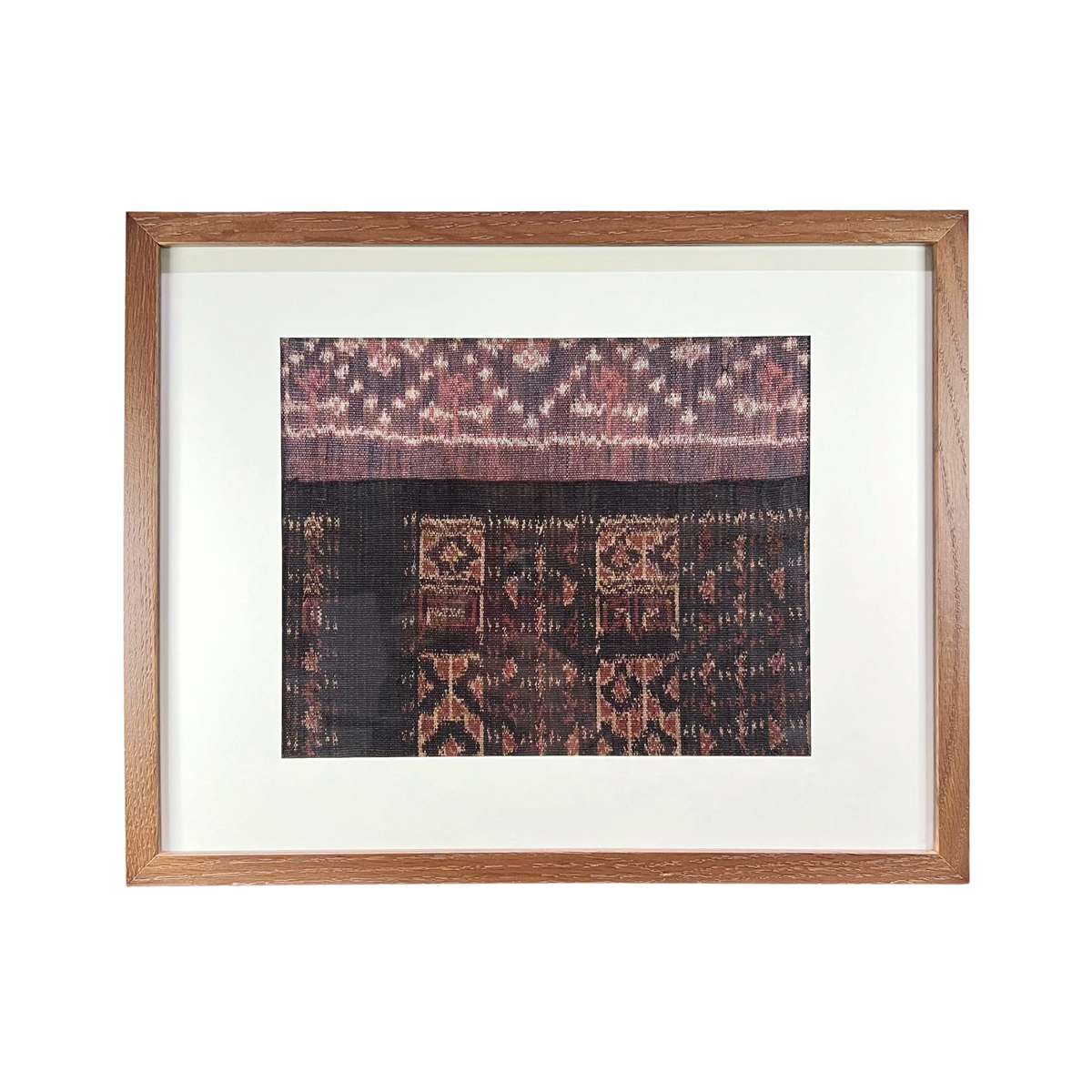 Framed textile with intricate patterns on a white background
