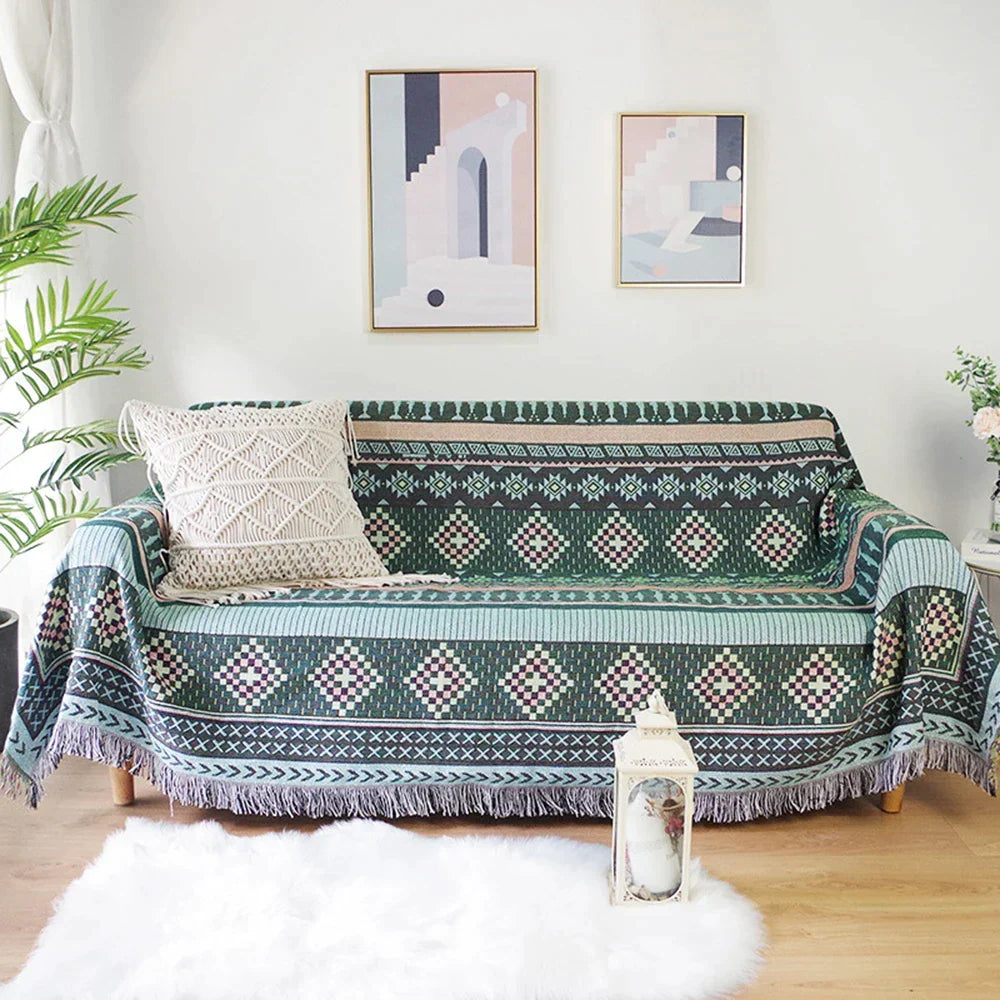 Sofa with a patterned throw blanket in a living room setting