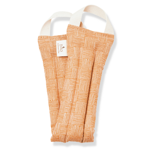 Orange patterned neck wrap with white handles on a white background