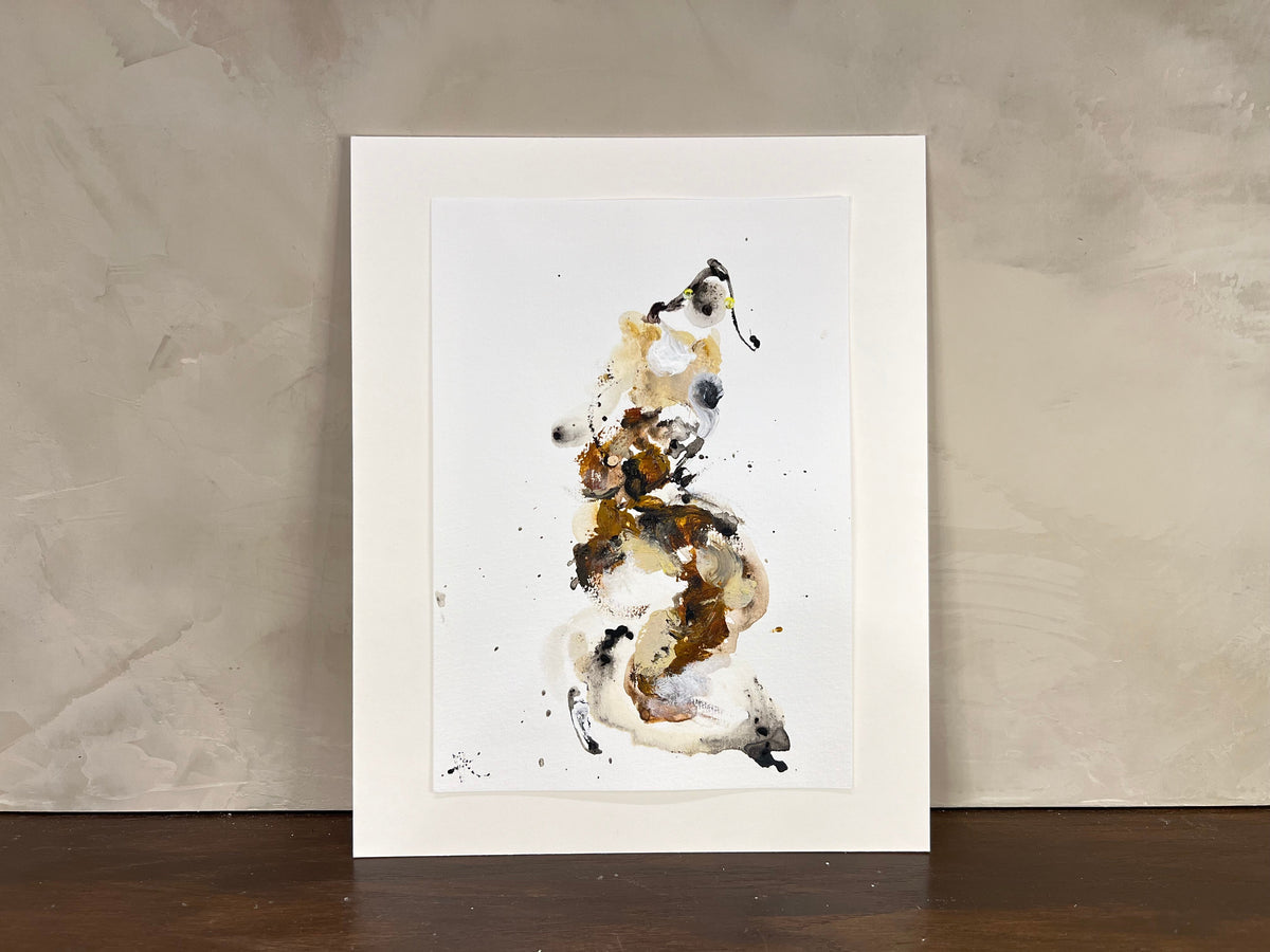 Framed abstract art print on a textured wall