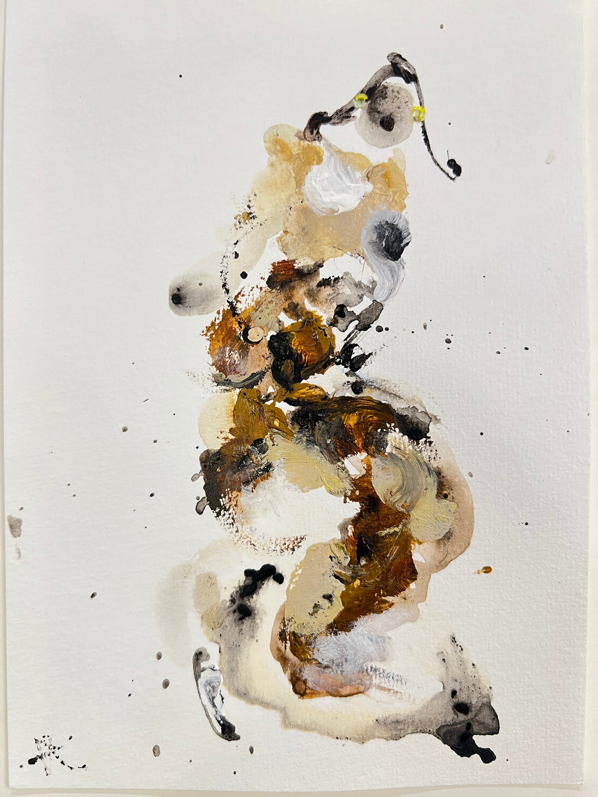 Abstract art piece with splashes of brown, black, and white on a light gray background