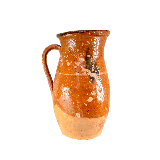 Terracotta pitcher on a white background