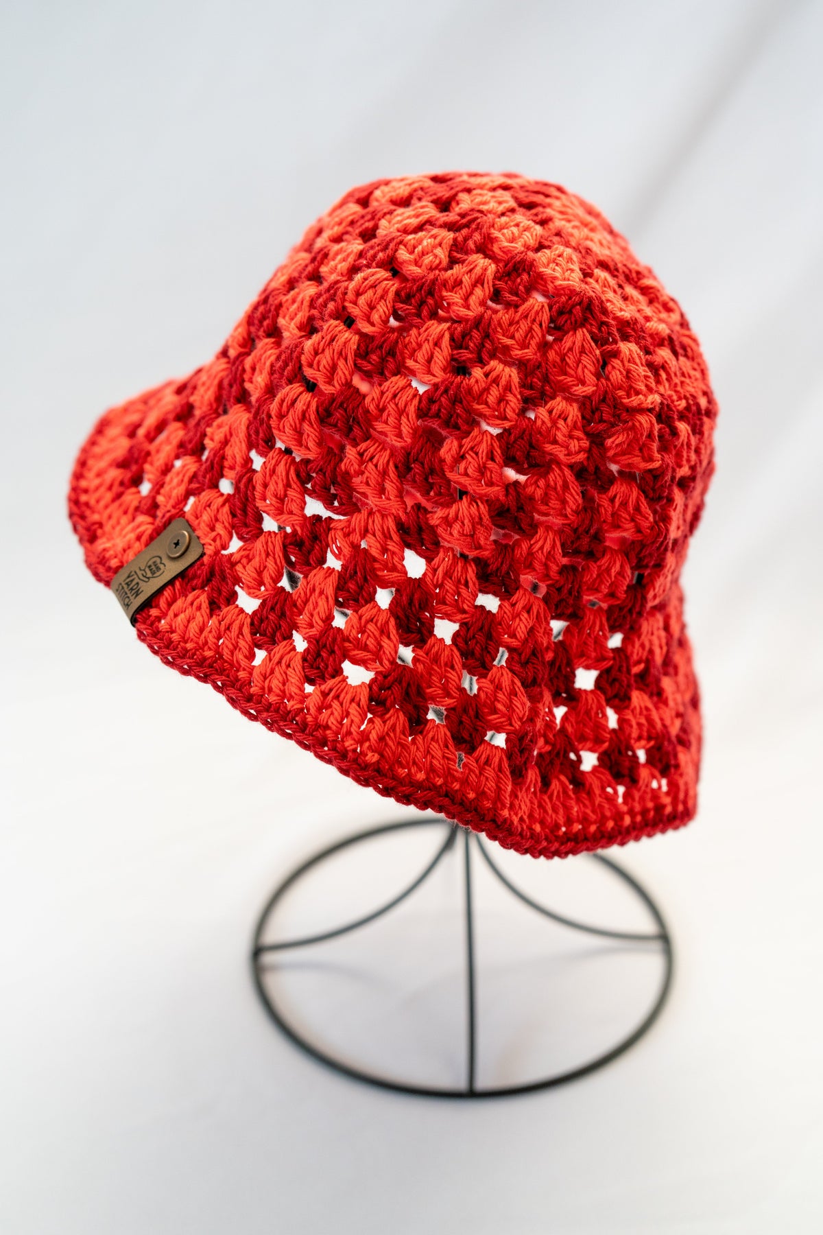 Red crochet hat on a white background