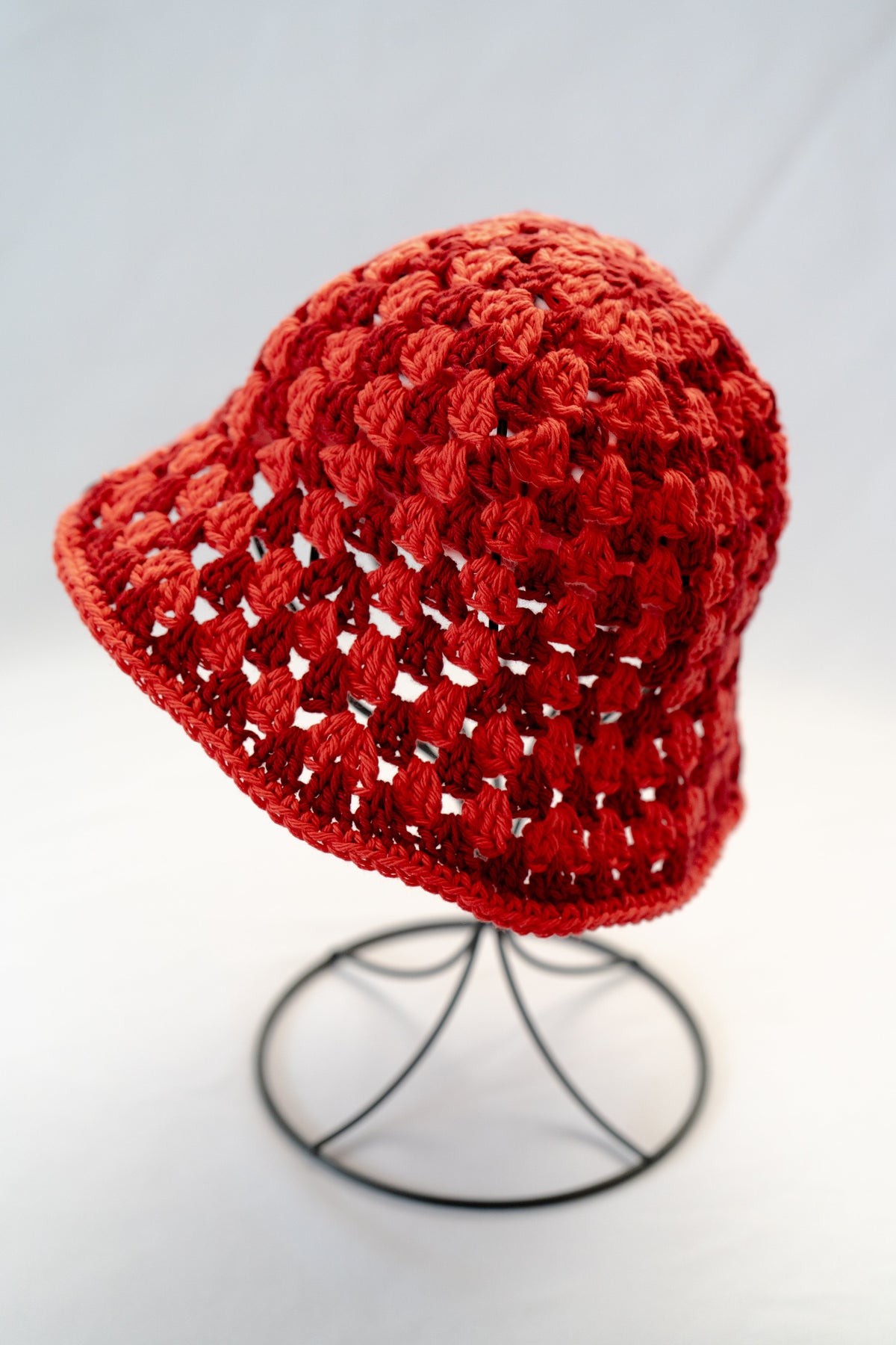 Red crochet hat on a white background