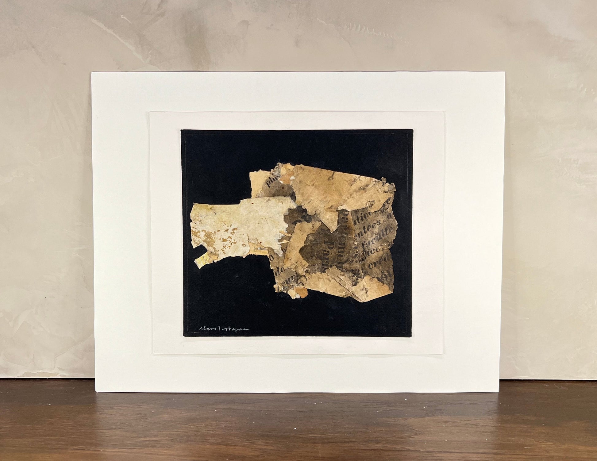 Framed artwork of a textured map on a black background