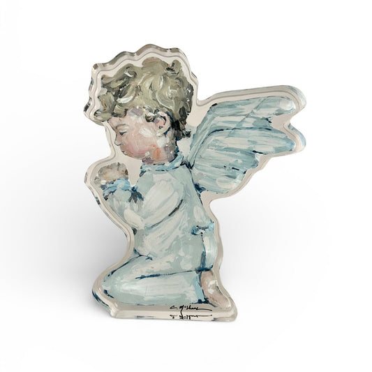 Decorative angel figurine with pastel colors on a white background