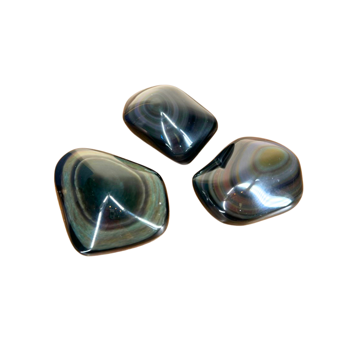 Three polished gemstones on a white background