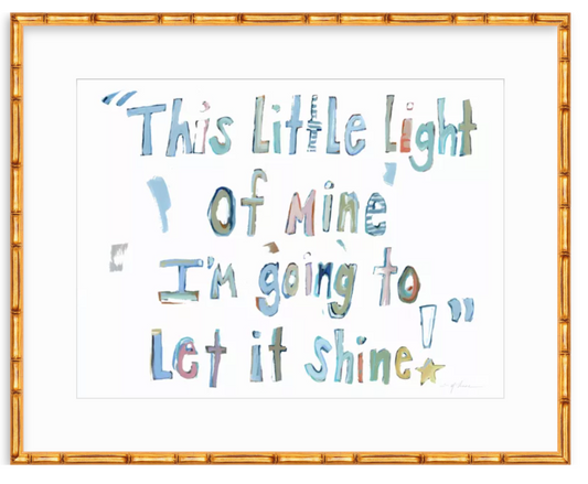 Framed watercolor art print featuring the quote 'This little light of mine I'm going to let it shine!' in multicolored hand-lettered text on a white background, enclosed in a gold bamboo-style frame.