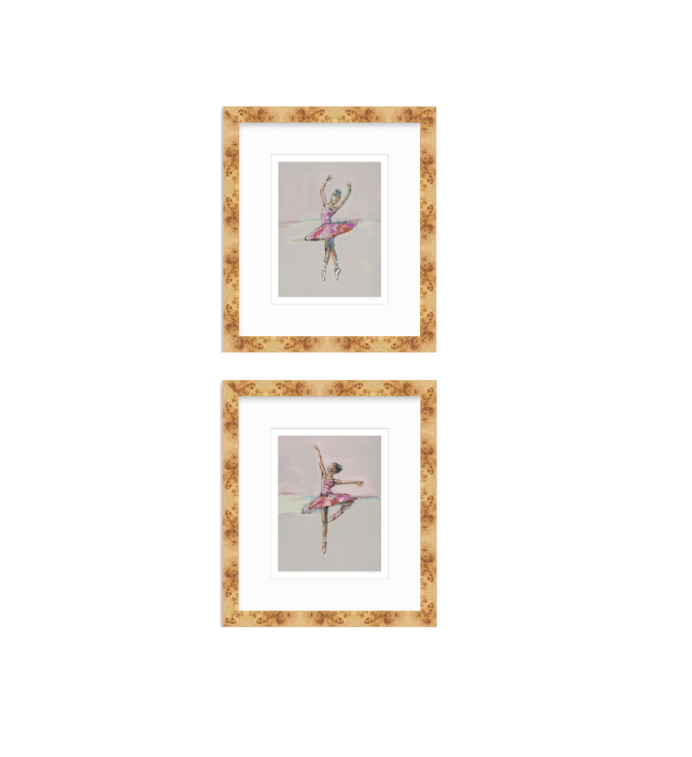Two framed art prints featuring watercolor illustrations of ballerinas in pink tutus, arranged vertically on a white background. The prints are matted in white and enclosed in a textured, warm gold-brown frame.