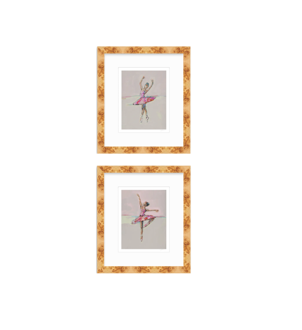 Two framed art prints featuring watercolor illustrations of ballerinas in pink tutus, arranged vertically on a white background. The prints are matted in white and enclosed in a textured, warm gold-brown frame.