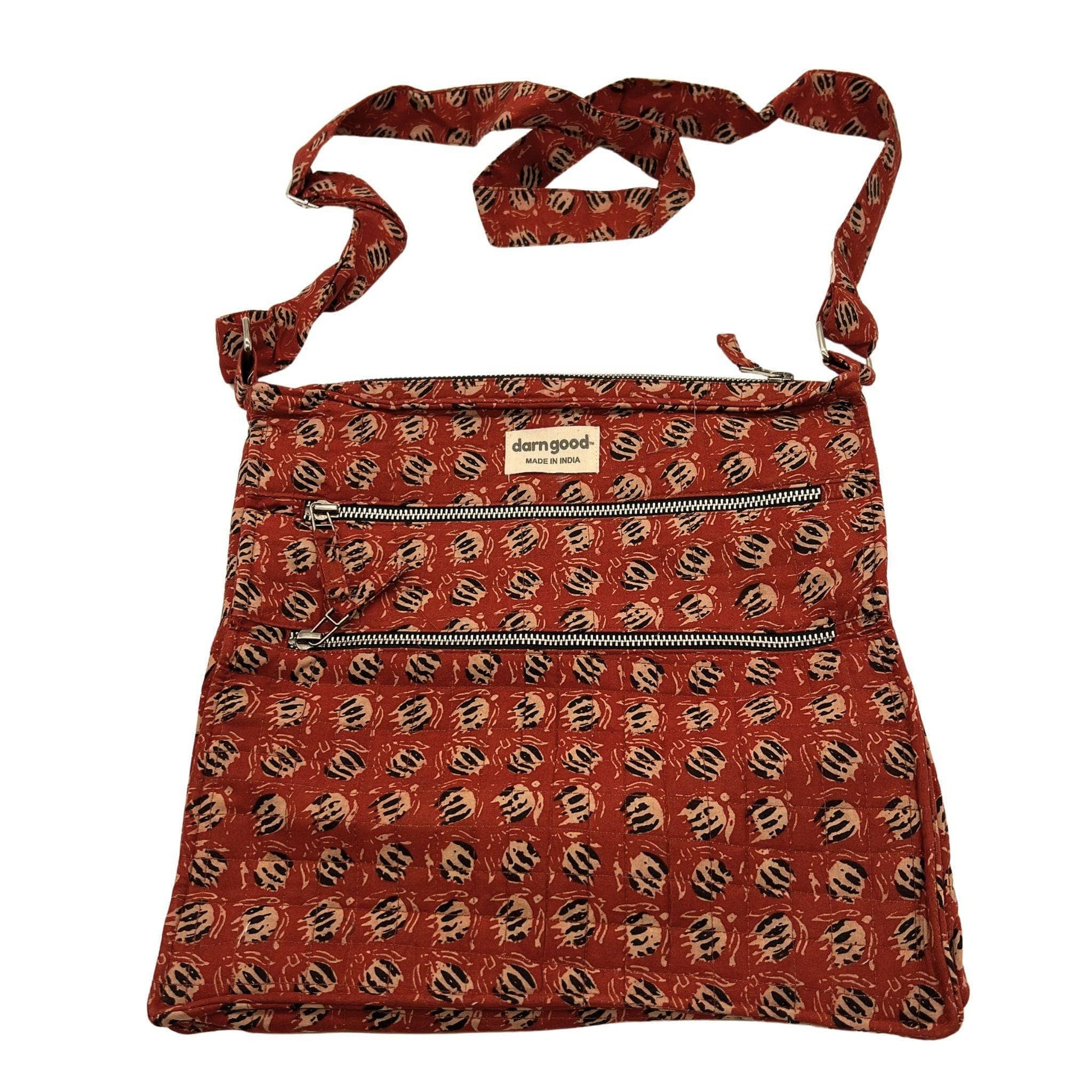 Red patterned bag with a visible brand logo on a white background