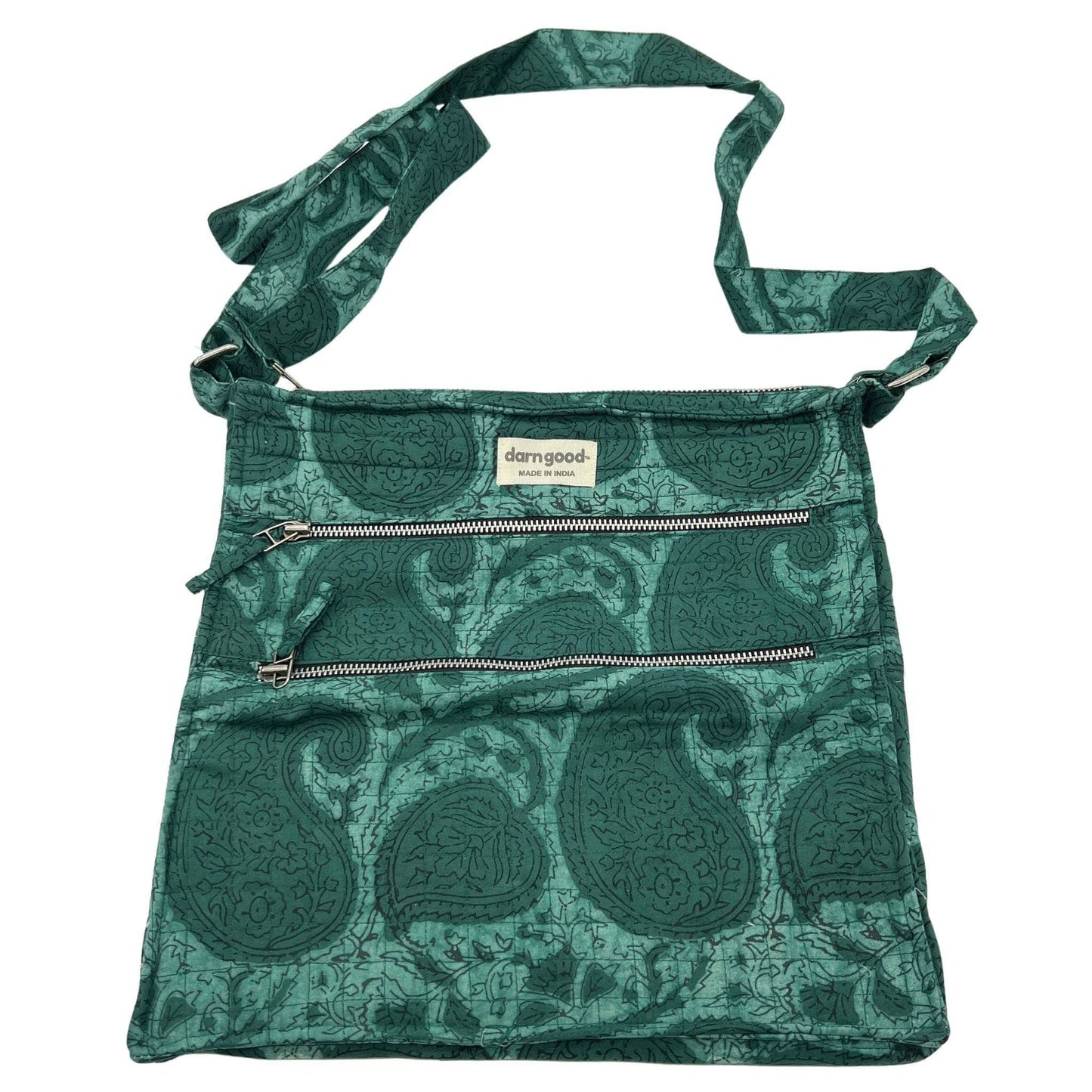 Green patterned bag with a visible brand label on a white background