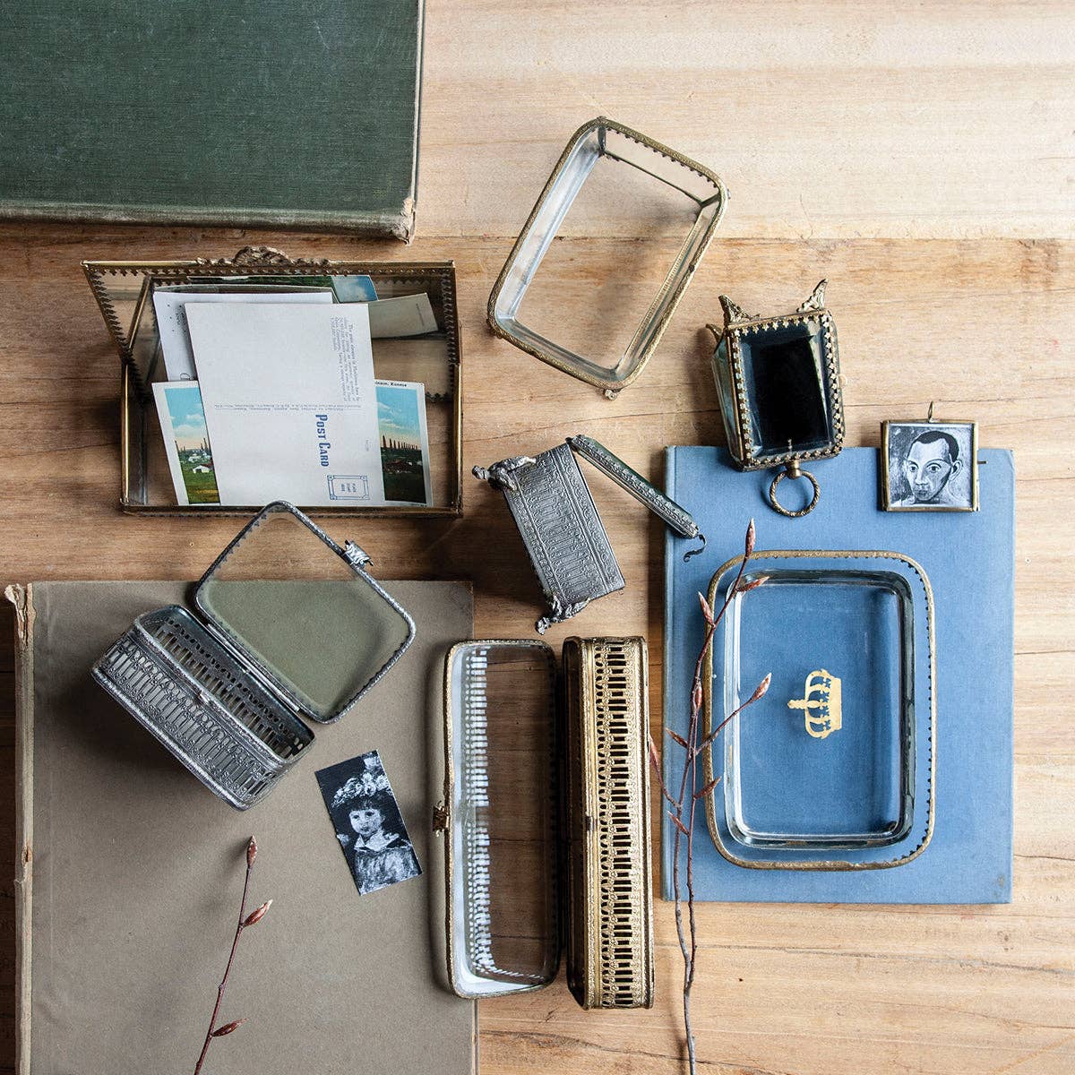 Collection of vintage accessories and photo frames on a wooden surface