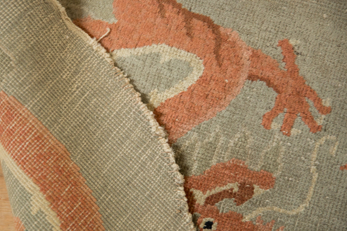 Close-up of a textured fabric with a pattern, featuring shades of brown and beige.