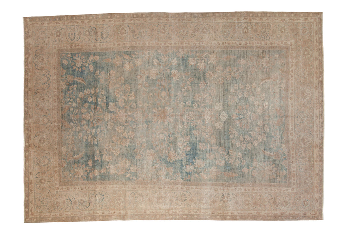 Decorative rug with intricate patterns on a plain background