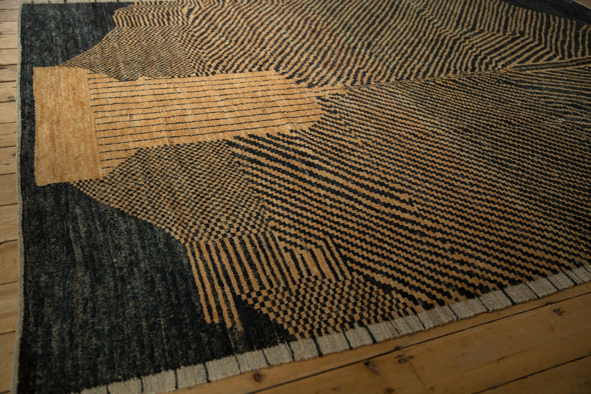 Textured rug with geometric pattern on wooden floor