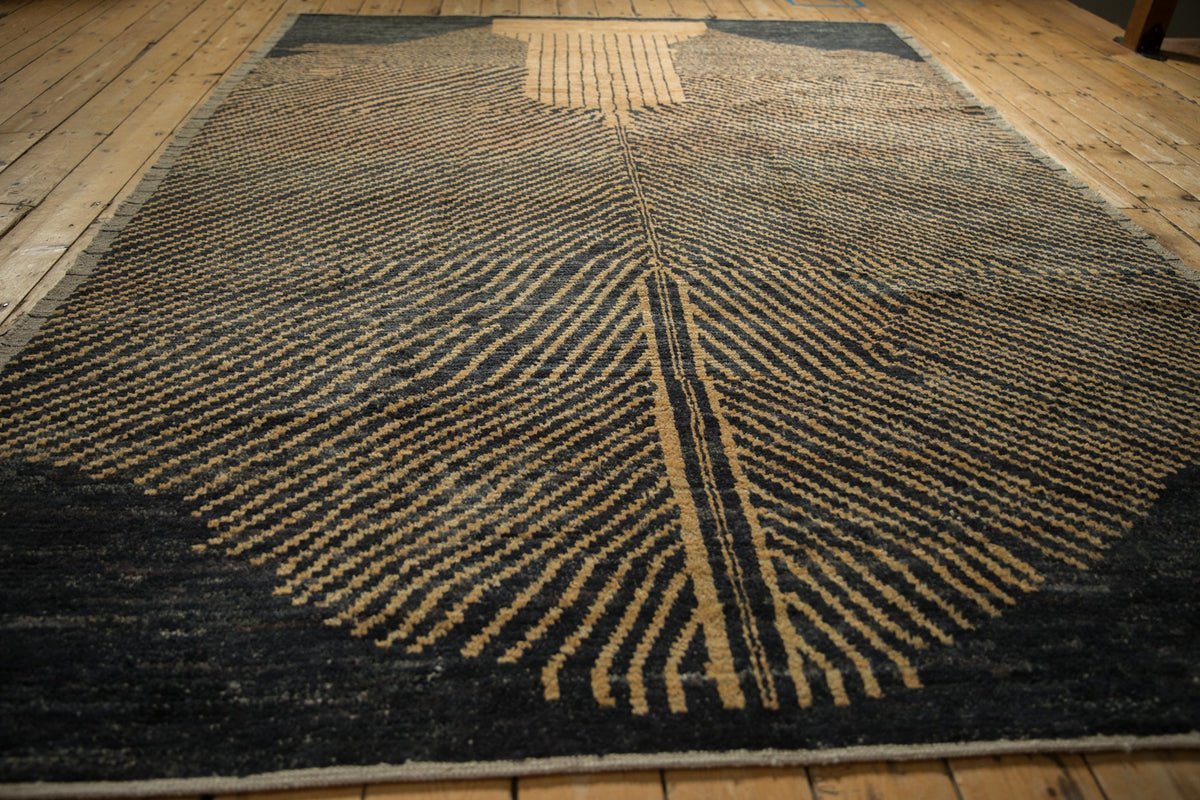 Geometric patterned rug on a wooden floor