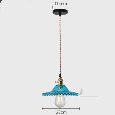 Vintage-style pendant light with blue glass shade and clear bulb on a white background