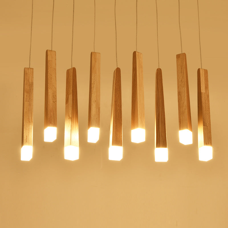 Wooden pendant lights with a warm glow on a beige background