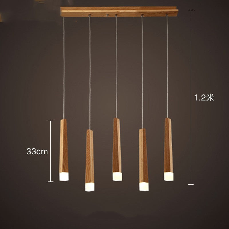 Wooden pendant light fixture with measurements on a dark background