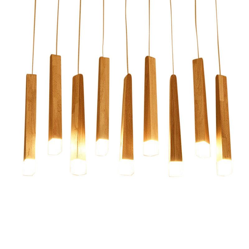 Wooden pendant lights hanging against a white background