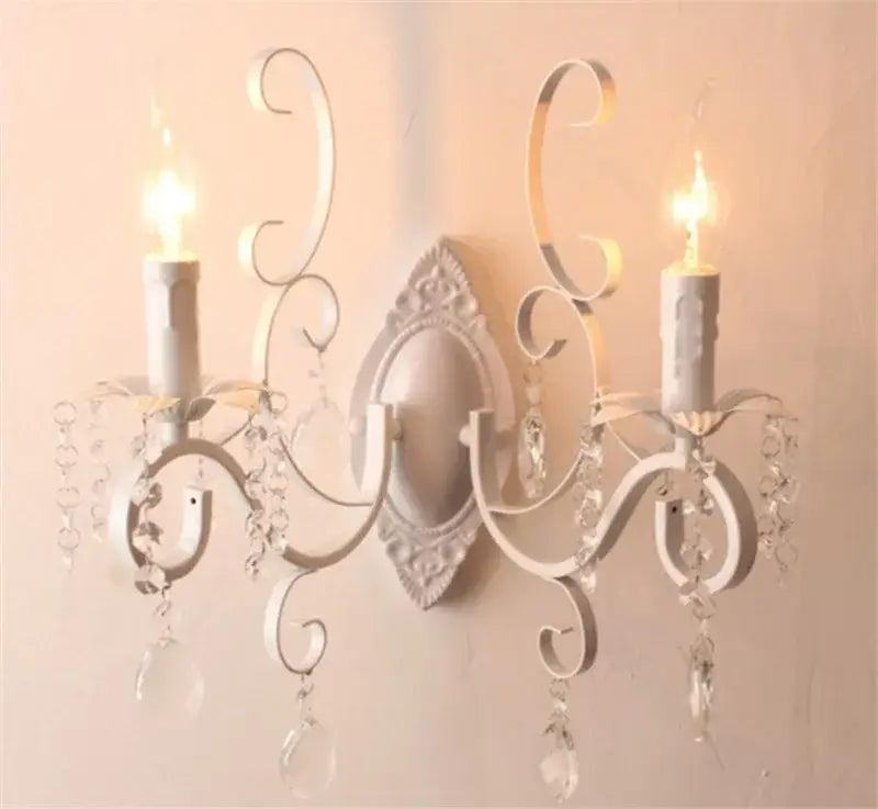 Decorative wall sconce with crystal accents on a light background