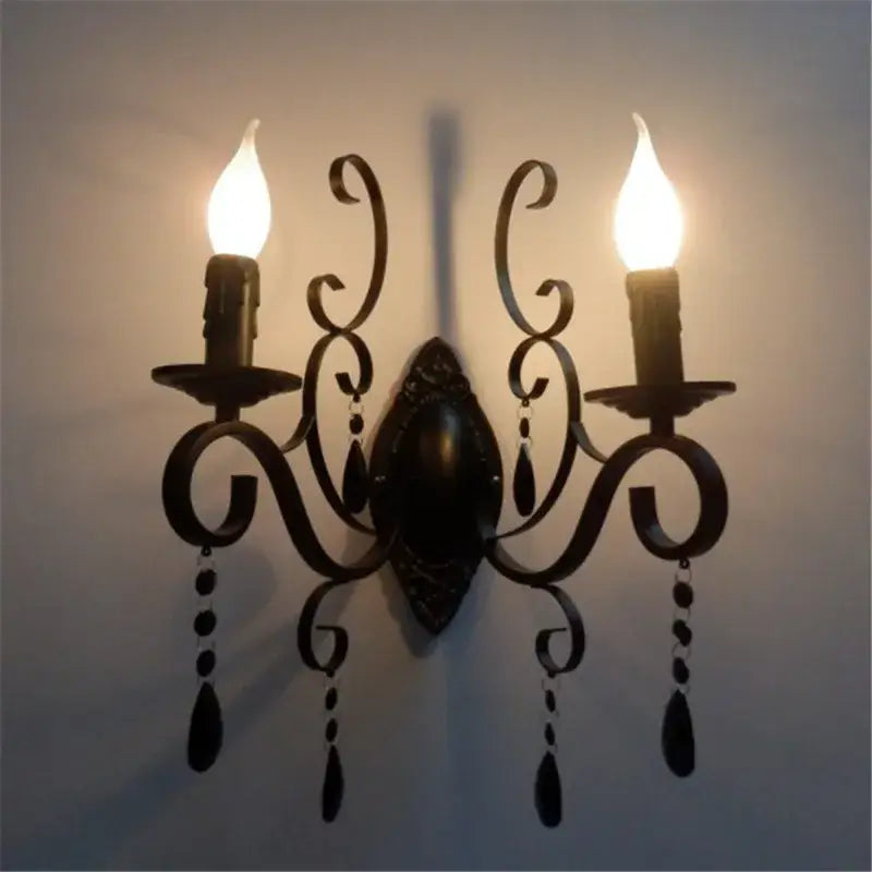 Decorative wall sconce with two lights on a plain background