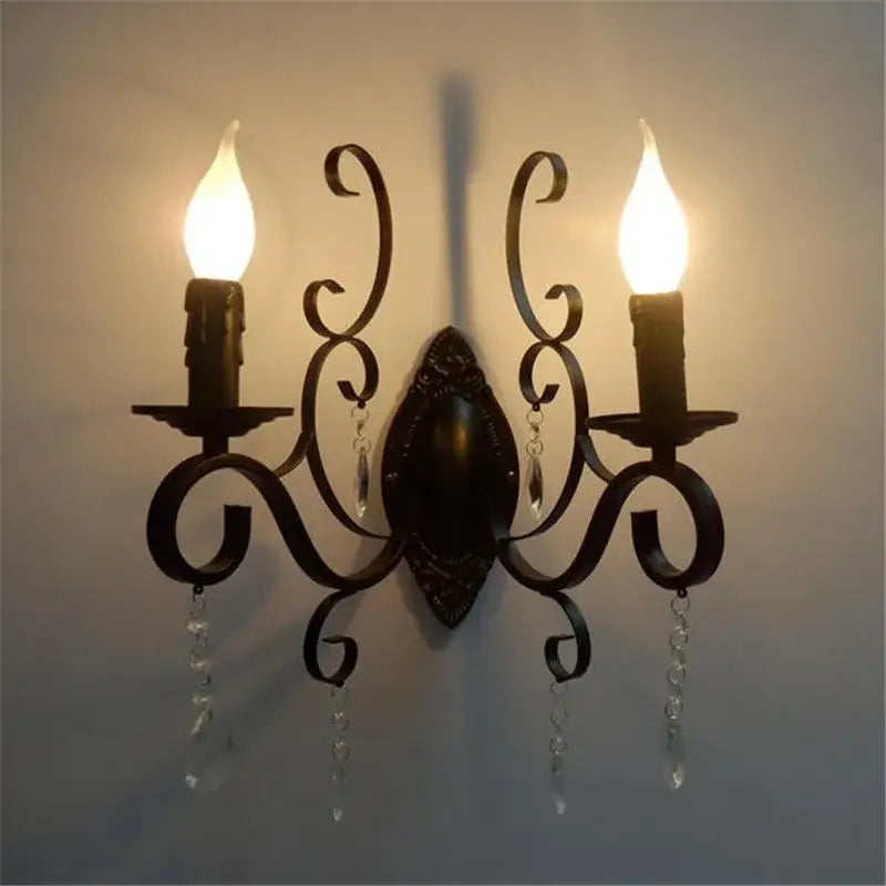 Decorative wall sconce with two lights on a plain background